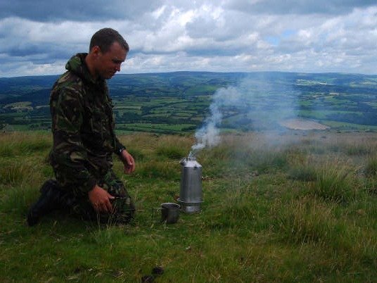 A STORM Kettle steaming away at the top of a hill in Wales with wonderful scenic view